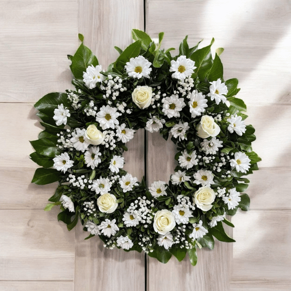 Corona floral fúnebre blanca