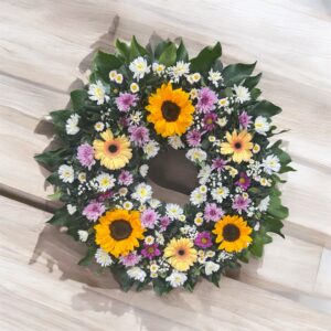 Corona floral fúnebre amarilla